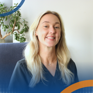 Victoria Hayes – Thrive Feeding Clinic Professional headshot of Victoria Hayes seated indoors with a plant behind.